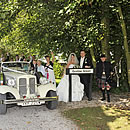Gretna Green sign and Scottish Piper at Anvil Hall